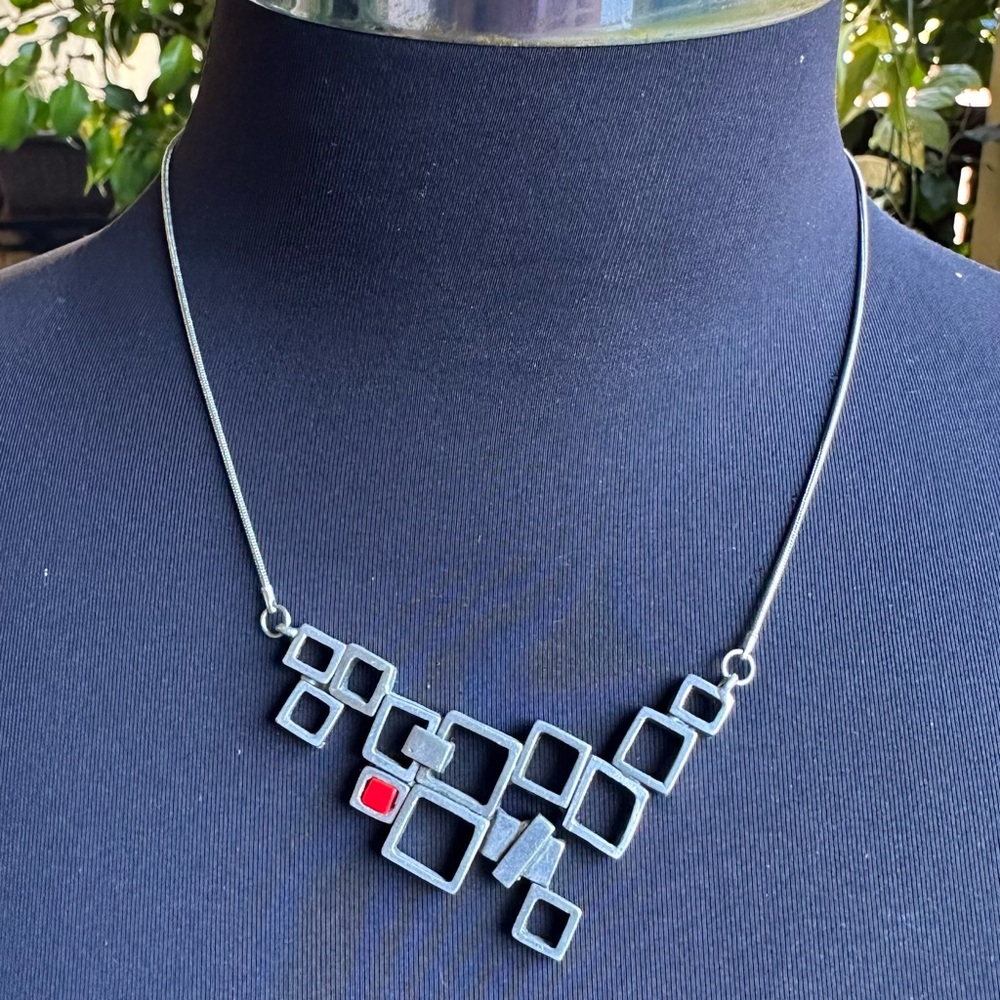 Silver Metal Geometric Necklace with Asymmetrical Design. Canadian designer.